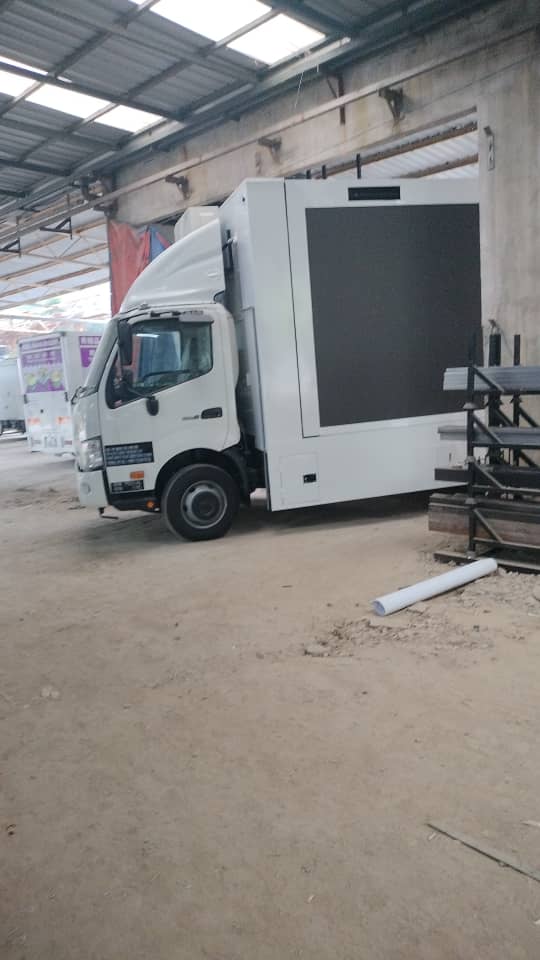 Hino truck with a large LED screen built into the body