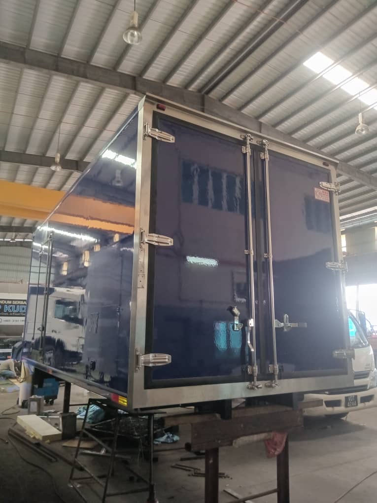 Box body on workshop stands, panels in blue protective film
