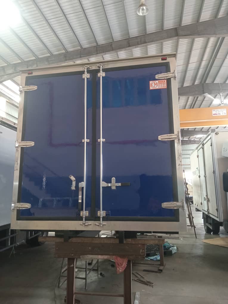 Box body under construction with panels still in blue protective film